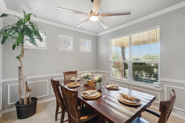 8208 Rock Elm Rd, Fort Worth, TX 76131 - dining space featuring light tile patterned floors, a decorative wall, a ceiling fan, ornamental molding, and wainscoting