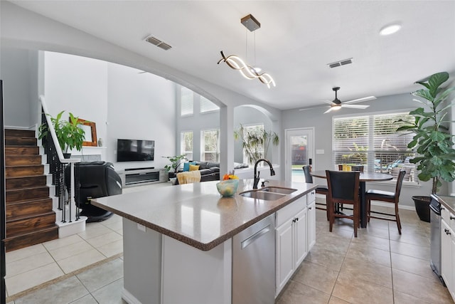 8208 Rock Elm Rd, Fort Worth, TX 76131 - kitchen with a sink, plenty of natural light, white cabinets, and dishwasher
