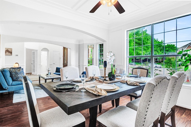 2283 Fox Crossing Ln, Frisco, TX 75036 - dining area with crown molding, arched walkways, a ceiling fan, and a decorative wall