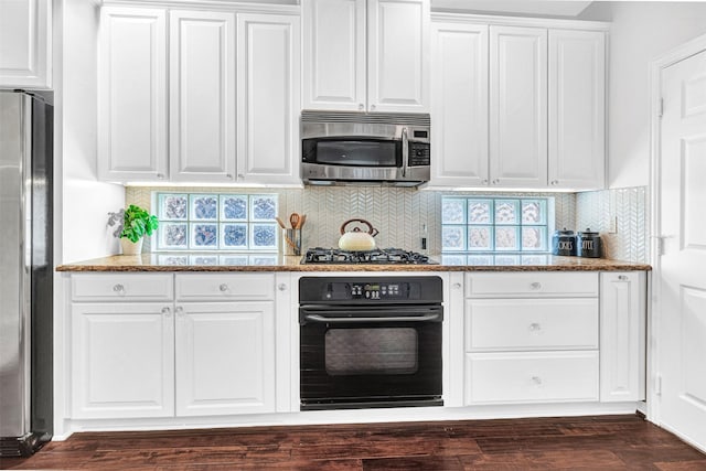 kitchen featuring white cabinetry and appliances with stainless steel finishes