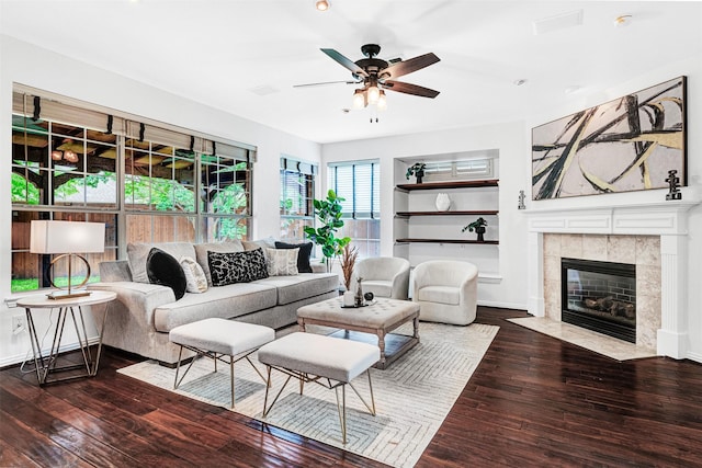 2283 Fox Crossing Ln, Frisco, TX 75036 - living area with ceiling fan, a fireplace, built in shelves, wood-type flooring, and recessed lighting