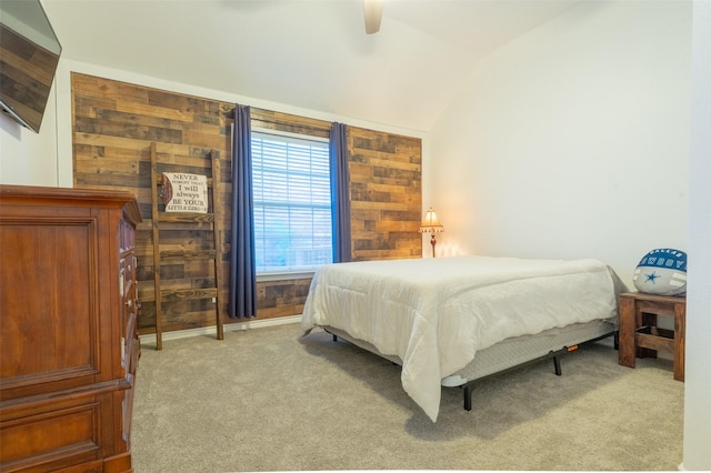 bedroom with ceiling fan, lofted ceiling, and light colored carpet