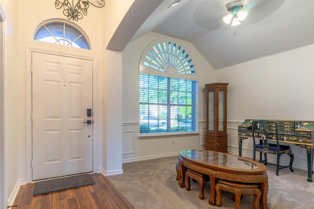 entryway featuring ceiling fan, wood finished floors, and vaulted ceiling