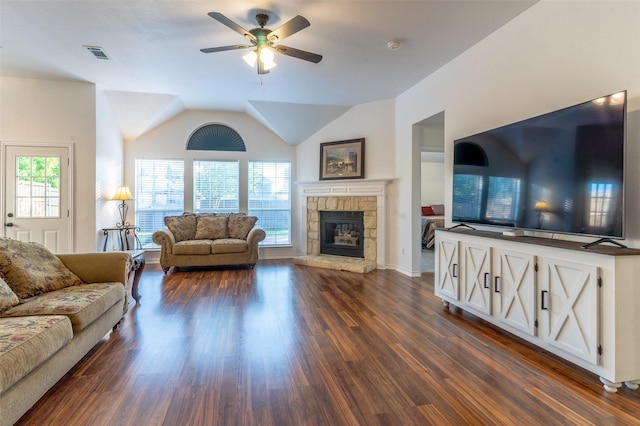 living room featuring a ceiling fan, visible vents, a fireplace, dark wood finished floors, and lofted ceiling