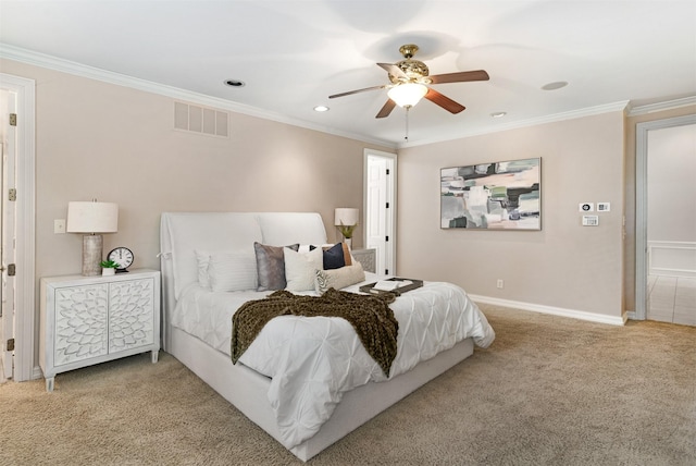 carpeted bedroom with ceiling fan, recessed lighting, baseboards, visible vents, and ornamental molding