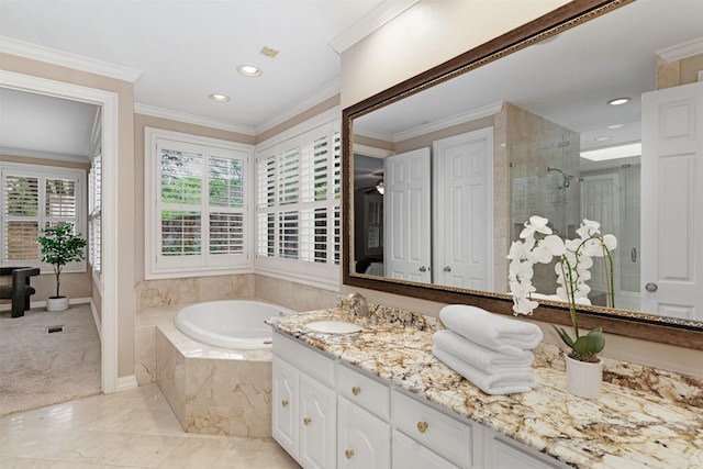 bathroom featuring vanity, recessed lighting, baseboards, a bath, and a stall shower