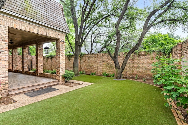 view of yard with a patio and a fenced backyard