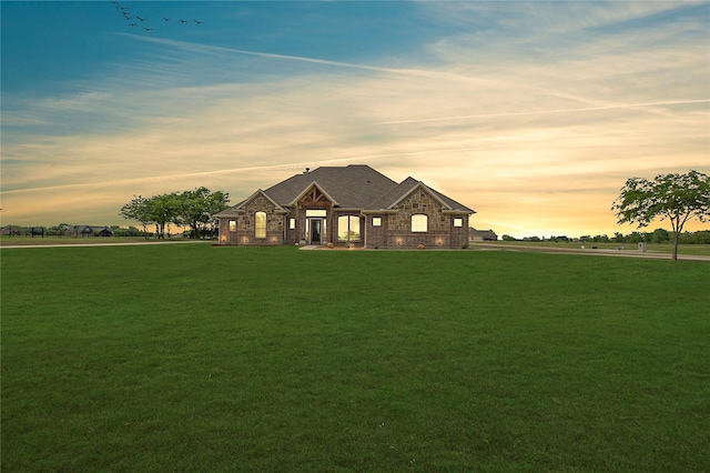 view of front of home featuring a lawn