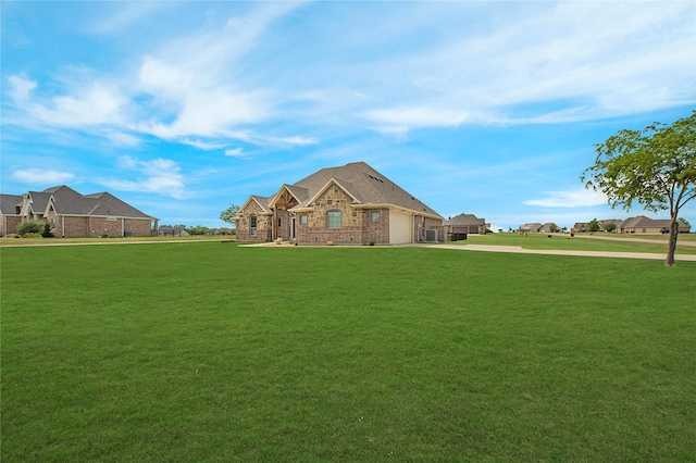 view of front of home with brick siding, a garage, a front lawn, and concrete driveway