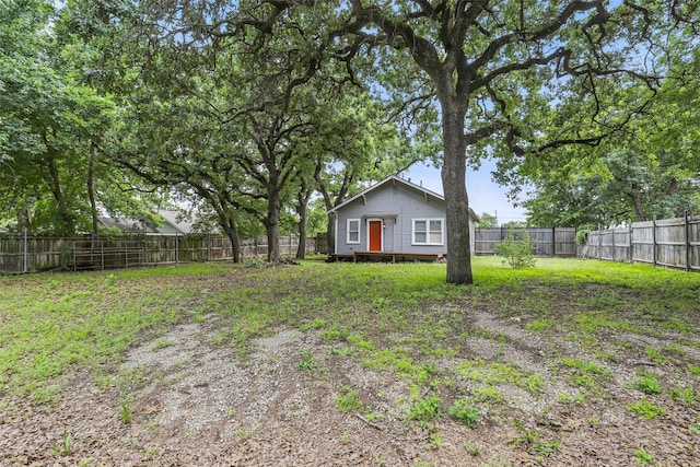 view of yard with a fenced backyard