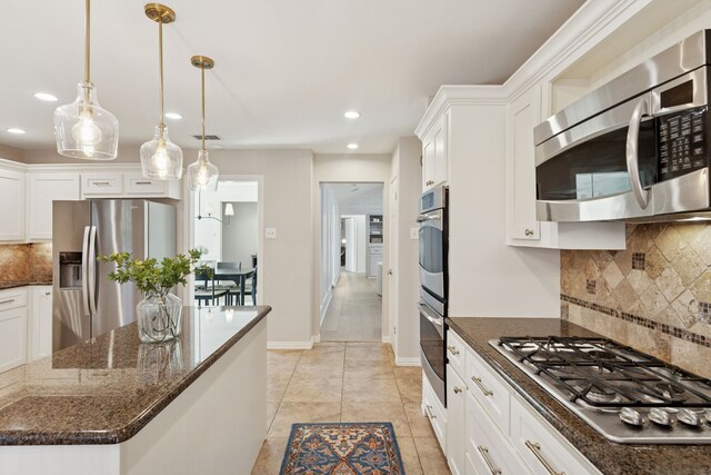 kitchen with recessed lighting, white cabinetry, and appliances with stainless steel finishes