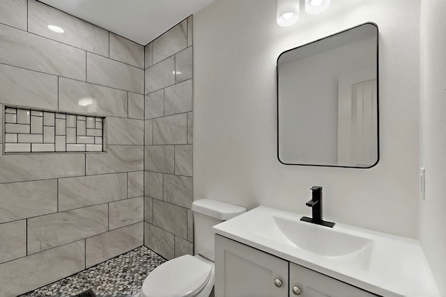 2188 Jordan Valley Dr, Dallas, TX 75253 - full bathroom featuring vanity, toilet, and a tile shower