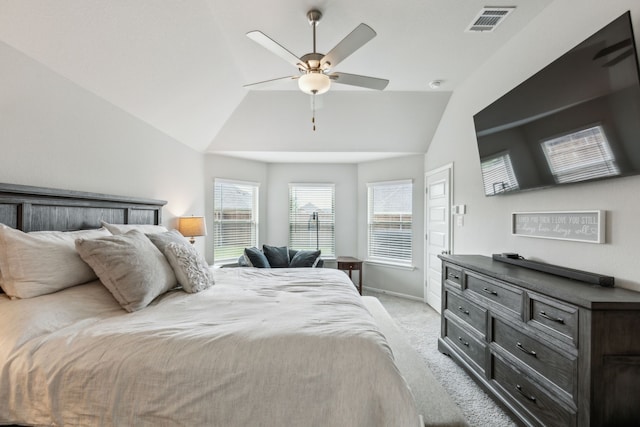 bedroom with baseboards, light colored carpet, lofted ceiling, and visible vents