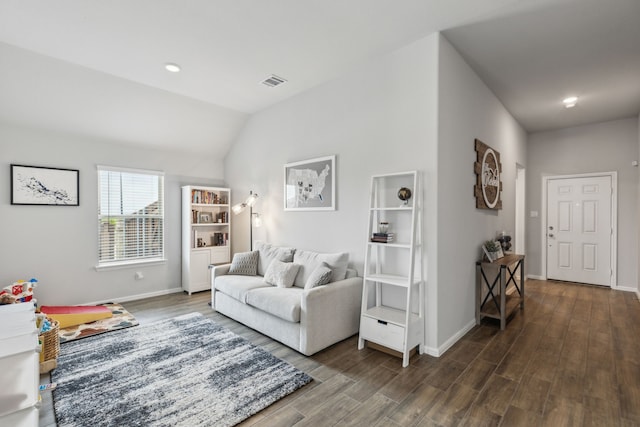 living area with visible vents, baseboards, dark wood-style floors, and vaulted ceiling