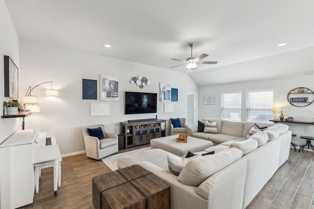 living room with ceiling fan, recessed lighting, baseboards, wood finished floors, and vaulted ceiling