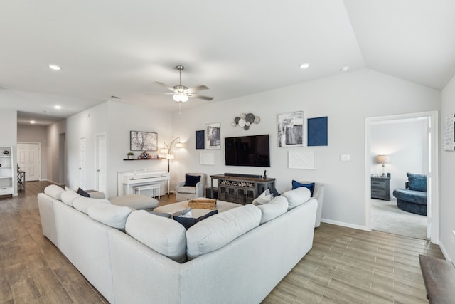 living room with a ceiling fan, baseboards, recessed lighting, and wood finished floors