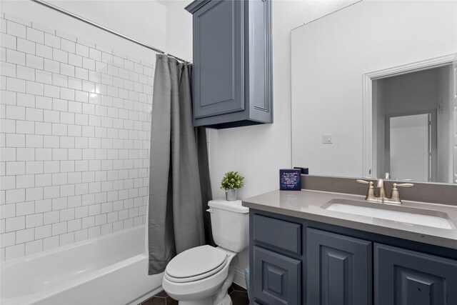 full bathroom with vanity, shower / bath combo, and toilet