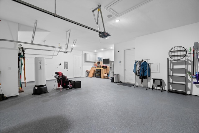 garage with recessed lighting, a garage door opener, and electric panel
