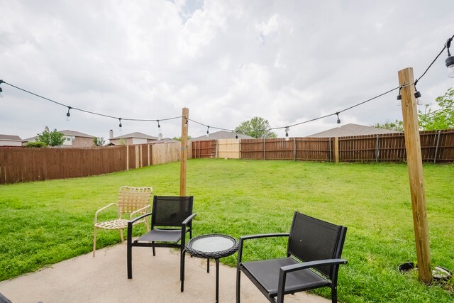 view of yard with a fenced backyard and a patio area