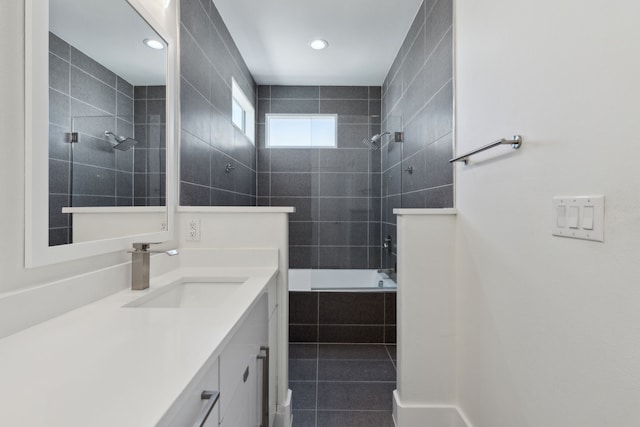 bathroom featuring recessed lighting, tiled shower / bath, tile patterned flooring, and vanity