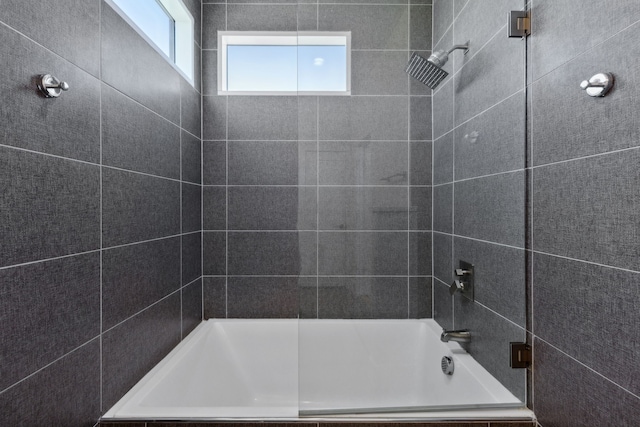 bathroom featuring tiled shower
