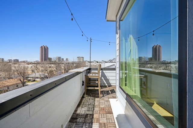 balcony featuring a city view