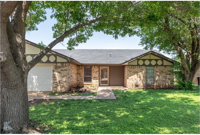 ranch-style home featuring brick siding, a garage, roof with shingles, and a front yard