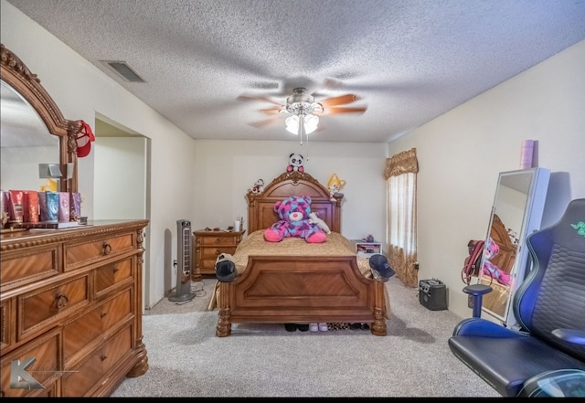 1310 Summoner Ln, Abilene, TX 79602 - bedroom featuring carpet floors, a ceiling fan, and a textured ceiling