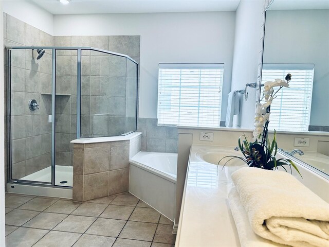 full bath with vanity, tile patterned floors, a shower stall, and a garden tub