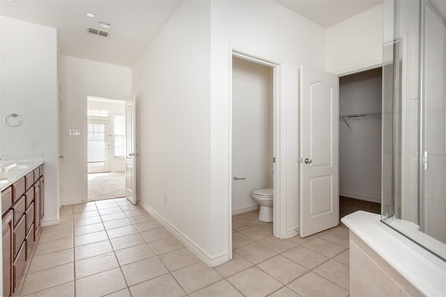 full bathroom featuring visible vents, tile patterned floors, toilet, and vanity