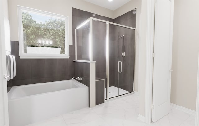 full bath with a bath, baseboards, a shower stall, and marble finish floor