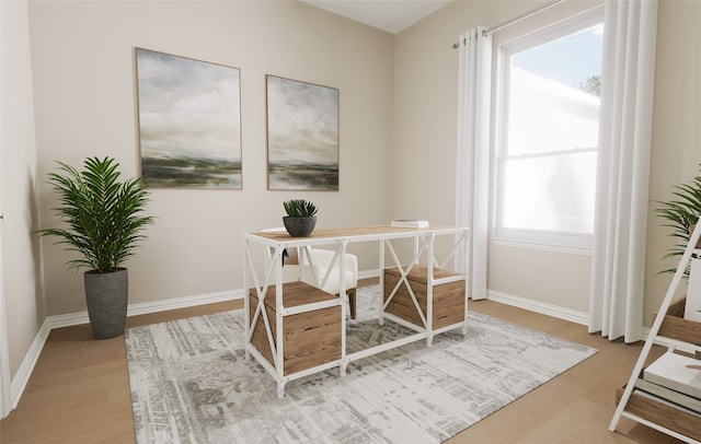 office featuring baseboards and wood finished floors