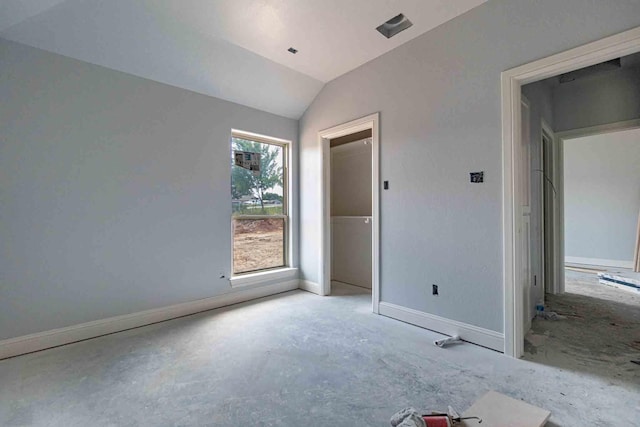 3406 Woodlake Dr, Granbury, TX 76048 - unfurnished bedroom featuring baseboards and lofted ceiling