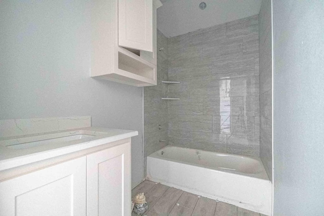 3406 Woodlake Dr, Granbury, TX 76048 - full bath with washtub / shower combination, vanity, and wood finished floors