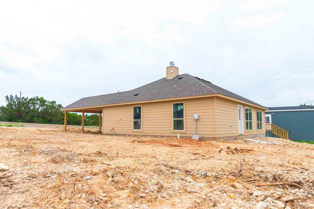 3406 Woodlake Dr, Granbury, TX 76048 - back of house featuring a chimney