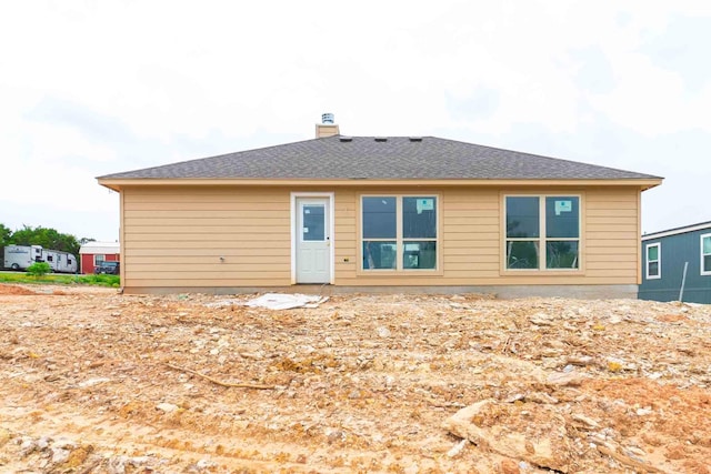 3406 Woodlake Dr, Granbury, TX 76048 - rear view of house with a chimney