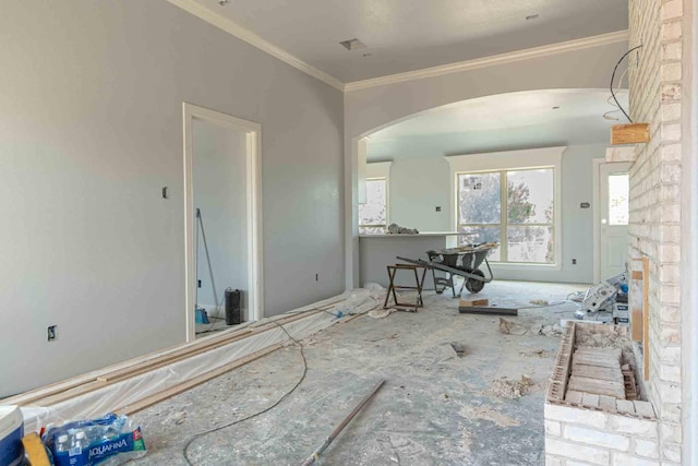 3406 Woodlake Dr, Granbury, TX 76048 - living room with arched walkways and ornamental molding