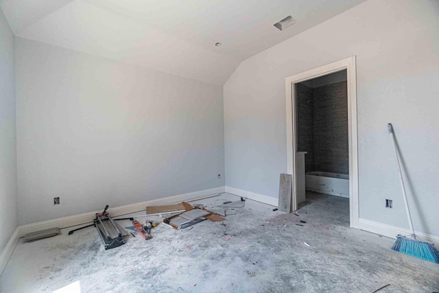 3406 Woodlake Dr, Granbury, TX 76048 - unfurnished bedroom with baseboards and vaulted ceiling
