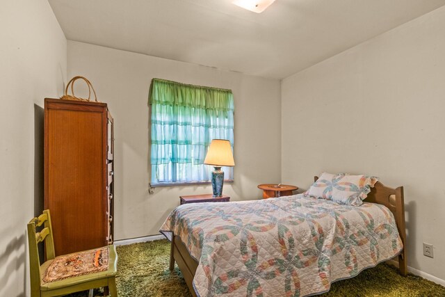 carpeted bedroom with baseboards