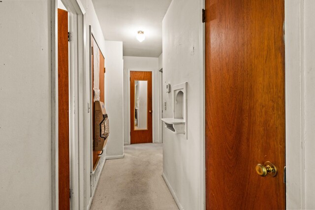 corridor featuring baseboards