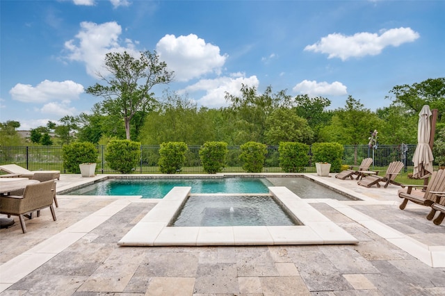 view of pool featuring an in ground hot tub, a fenced in pool, a fenced backyard, and a patio area