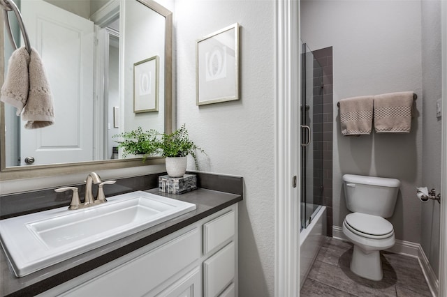 full bathroom with vanity, shower / bath combination with glass door, and toilet