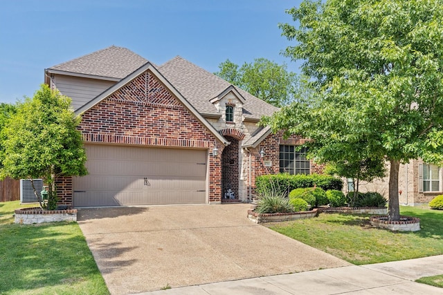1711 Crescent Oak St, Wylie, TX 75098 - traditional home featuring concrete driveway, a garage, brick siding, and a shingled roof