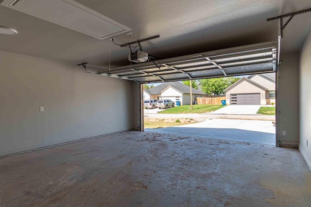 garage featuring baseboards and a garage door opener