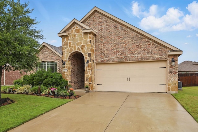 view of front facade featuring brick siding, a front lawn, driveway, and stone siding
