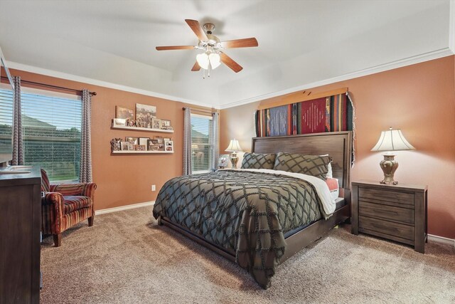 carpeted bedroom with baseboards, ceiling fan, and ornamental molding