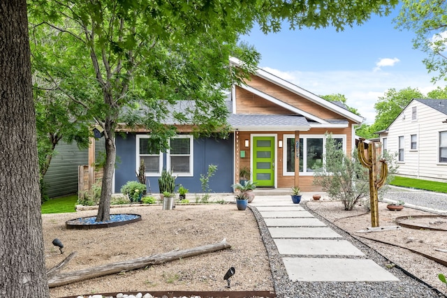 8911 Diceman Dr, Dallas, TX 75218 - view of front of home featuring roof with shingles