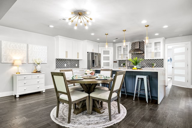 8911 Diceman Dr, Dallas, TX 75218 - dining space with recessed lighting, baseboards, and dark wood-style floors