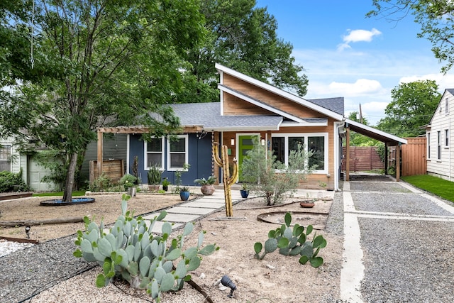 8911 Diceman Dr, Dallas, TX 75218 - contemporary house with roof with shingles, fence, and driveway