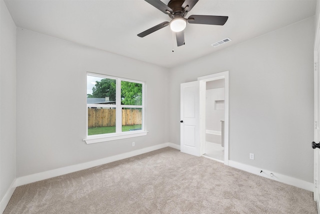 unfurnished bedroom with baseboards, visible vents, and carpet